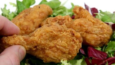 Deep fried spring chicken in golden lemon batter with salad